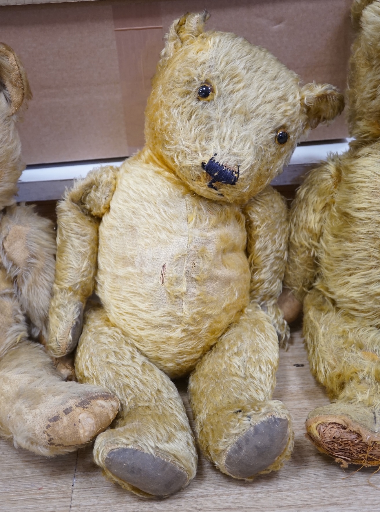 A Chiltern bear c.1950's, 55cm, tear to one velvet pad otherwise in good condition, and a 1930's bear, 50cm, repaired paw pads and nose